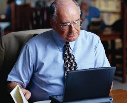 older man at laptop.