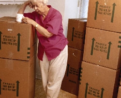 elderly woman with moving boxes