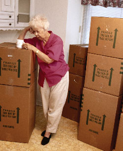 elderly woman with moving boxes
