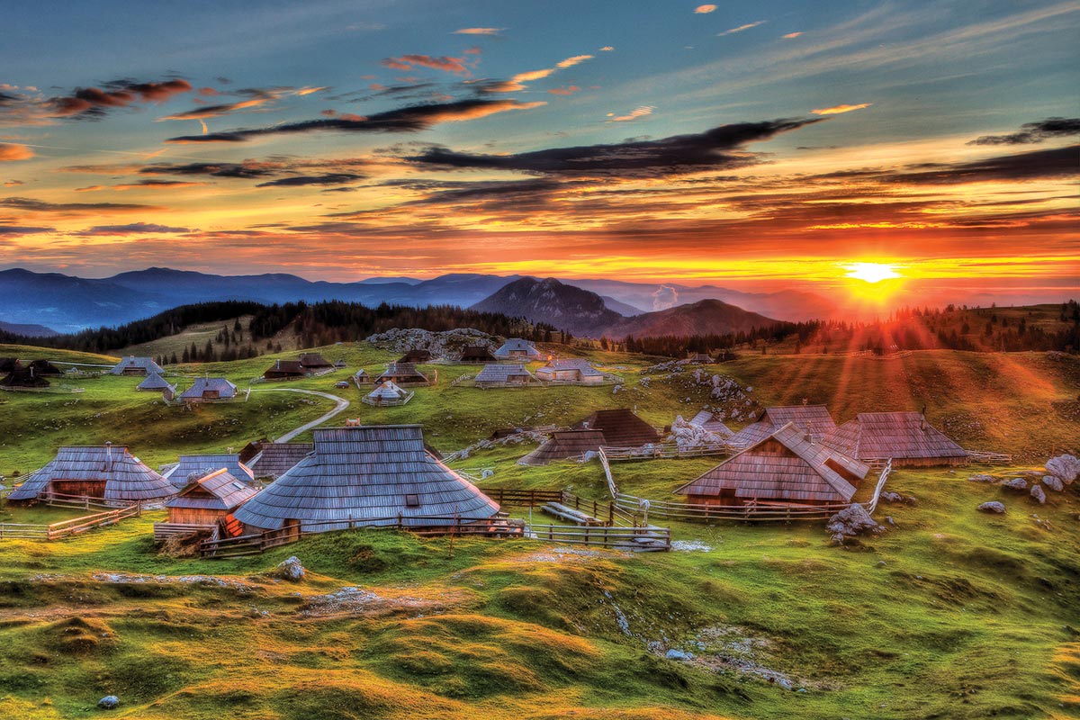 Both Worlds Travel - Slovenia - Village with Sun